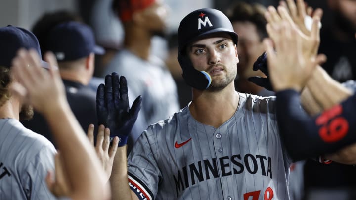 Jul 8, 2024; Chicago, Illinois, USA; Minnesota Twins outfielder Matt Wallner (38) celebrates with teammates in the dugout after hitting a two-run home run against the Chicago White Sox during the seventh inning at Guaranteed Rate Field. Mandatory Credit: Kamil Krzaczynski-USA TODAY Sports