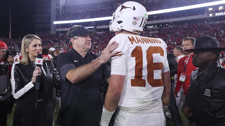 Nov 15, 2025; Athens, Georgia, USA; Georgia Bulldogs head coach Kirby Smart and Texas Longhorns quarterback Arch Manning (16) interact after a game at Sanford Stadium. Mandatory Credit: Brett Davis-Imagn Images