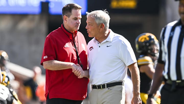 Sep 27, 2025; Iowa City, Iowa, USA; Iowa Hawkeyes head coach Kirk Ferentz and Indiana Hoosiers head coach Curt Cignetti shake hands before the game at Kinnick Stadium. Mandatory Credit: Jeffrey Becker-Imagn Images