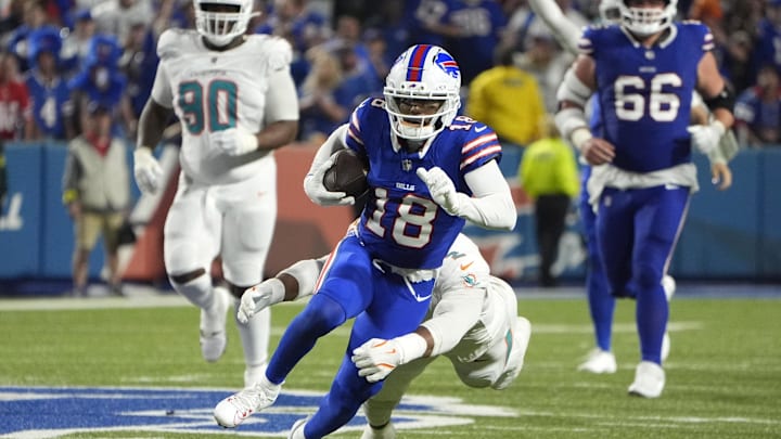 Buffalo Bills wide receiver Elijah Moore (18) runs against Miami Dolphins outside linebacker Bradley Chubb (2) in the fourth quarter at Highmark Stadium.