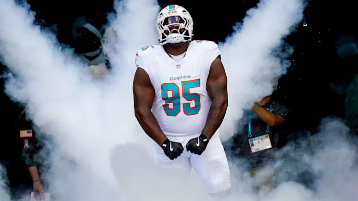 Miami Dolphins defensive tackle Benito Jones runs on the field before a game against the Buffalo Bills at Hard Rock Stadium in 2025.