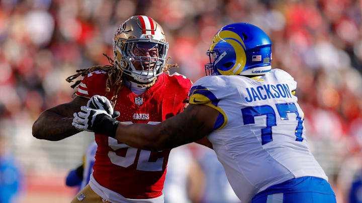 Jan 7, 2024; Santa Clara, California, USA; San Francisco 49ers defensive end Chase Young (92) rushes the passer against Los Angeles Rams offensive tackle Alaric Jackson (77) during the second quarter at Levi's Stadium. Mandatory Credit: Sergio Estrada-Imagn Images