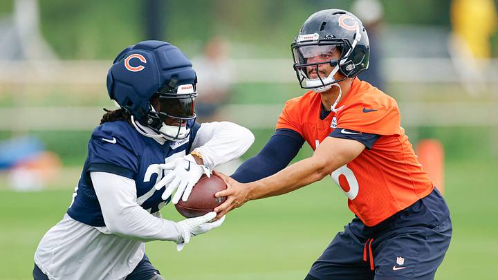 Chicago Bears quarterback Caleb Williams (18) hands the ball off to running back Kyle Monangai (25) during training camp at Halas Hall. Mandatory Credit: Kamil Krzaczynski-Imagn Images