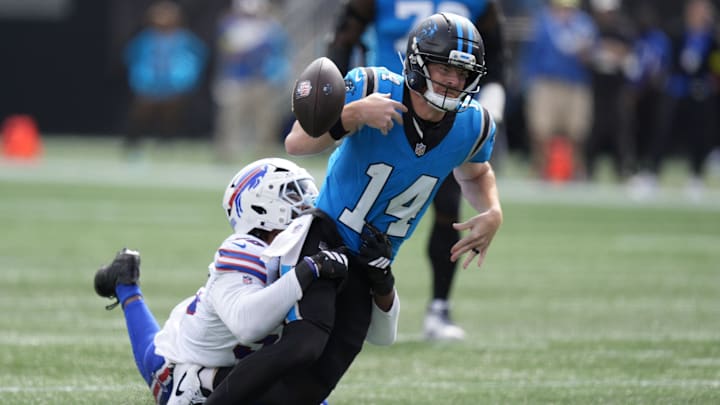 Oct 26, 2025; Charlotte, North Carolina, USA; Buffalo Bills defensive end Greg Rousseau (50) causes a fumble by Carolina Panthers quarterback Andy Dalton (14).