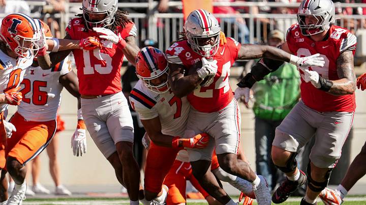 Ohio State Buckeyes running back Ja'kobi Jackson (24) runs through Illinois Fighting Illini defensive back Matthew Bailey (7) during the NCAA football game at Ohio Stadium in Columbus on Sept. 26, 2026.