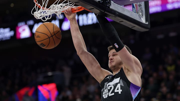 Jan 9, 2025; Salt Lake City, Utah, USA;  Utah Jazz center Walker Kessler (24) dunks the ball against the Miami Heat during the second half at Delta Center. Mandatory Credit: Chris Nicoll-Imagn Images
