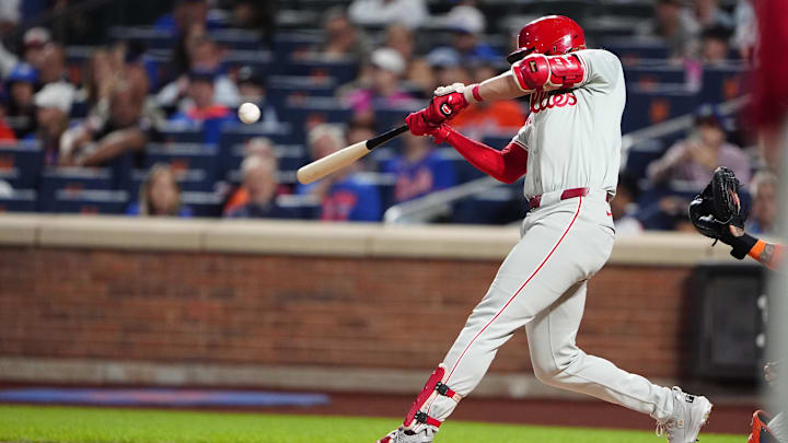 Sep 22, 2024; New York City, New York, USA; Philadelphia Phillies third baseman Alec Bohm (28) hits an RBI single against the New York Mets during the first inning at Citi Field. Sep 22, 2024; New York City, New York, USA; Philadelphia Phillies third baseman Alec Bohm (28) hits an RBI single against the New York Mets during the first inning at Citi Field.