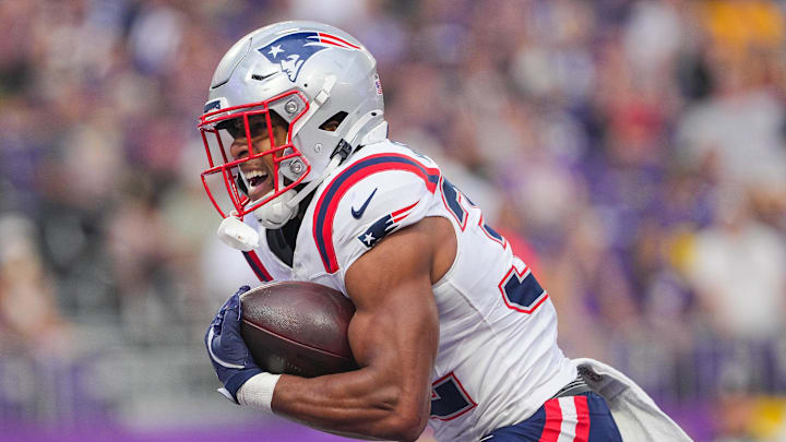 Aug 16, 2025; Minneapolis, Minnesota, USA; New England Patriots running back TreVeyon Henderson (32) celebrates his touchdown against the Minnesota Vikings in the first quarter at U.S. Bank Stadium. Mandatory Credit: Brad Rempel-Imagn Images