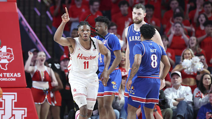 Mar 3, 2025; Houston, Texas, USA; Houston Cougars forward Joseph Tugler (11) reacts after scoring a basket during the first half against the Kansas Jayhawks at Fertitta Center. Mandatory Credit: Troy Taormina-Imagn Images