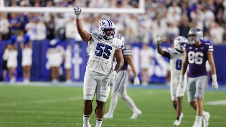 Sep 21, 2024; Provo, Utah, USA; Brigham Young Cougars defensive tackle John Taumoepeau (55) reacts to a tackle for a loss against the Kansas State Wildcats during the third quarter at LaVell Edwards Stadium. Mandatory Credit: Rob Gray-Imagn Images