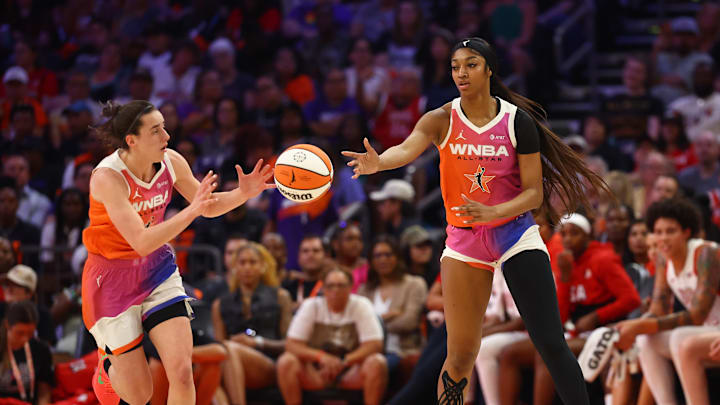 Jul 20, 2024; Phoenix, AZ, USA; Team WNBA guard Caitlin Clark (left) and Angel Reese against the USA Women's National Team during the 2024 WNBA All Star Game at Footprint Center. Mandatory Credit: Mark J. Rebilas-Imagn Images