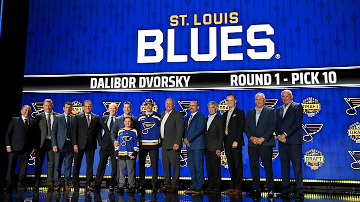 Jun 28, 2023; Nashville, Tennessee, USA; St. Louis Blues draft pick Dalibor Dvorsky stands with Blues staff after being selected with the tenth pick in round one of the 2023 NHL Draft at Bridgestone Arena. Mandatory Credit: Christopher Hanewinckel-Imagn Images