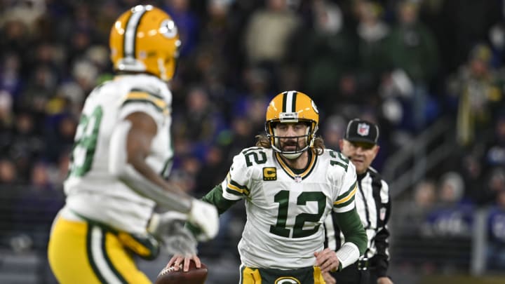 Dec 19, 2021; Baltimore, Maryland, USA;  Green Bay Packers quarterback Aaron Rodgers (12) looks to throw to tight end Marcedes Lewis (89)