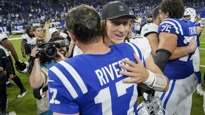 Dec 28, 2025; Indianapolis, Indiana, USA; Jacksonville Jaguars quarterback Trevor Lawrence (16) and Indianapolis Colts quarterback Philip Rivers (17) meet on the field  at Lucas Oil Stadium. Mandatory Credit: Grace Hollars-USA TODAY Network via Imagn Images