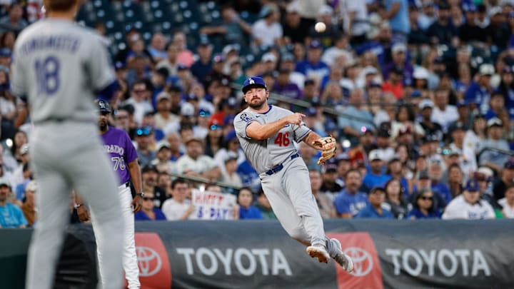 Aug 18, 2025; Denver, Colorado, USA; Los Angeles Dodgers third baseman Buddy Kennedy (46) makes a throw to first for an out in the fourth inning against the Colorado Rockies at Coors Field. Mandatory Credit: Isaiah J. Downing-Imagn Images Aug 18, 2025; Denver, Colorado, USA; Los Angeles Dodgers third baseman Buddy Kennedy (46) makes a throw to first for an out in the fourth inning against the Colorado Rockies at Coors Field. Mandatory Credit: Isaiah J. Downing-Imagn Images