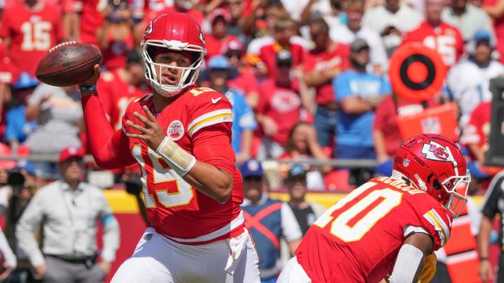 Aug 17, 2024; Kansas City, Missouri, USA; Kansas City Chiefs quarterback Patrick Mahomes (15) throws a pass after faking a handoff to running back Isiah Pacheco (10) against the Detroit Lions during the game at GEHA Field at Arrowhead Stadium. Mandatory Credit: Denny Medley-USA TODAY Sports