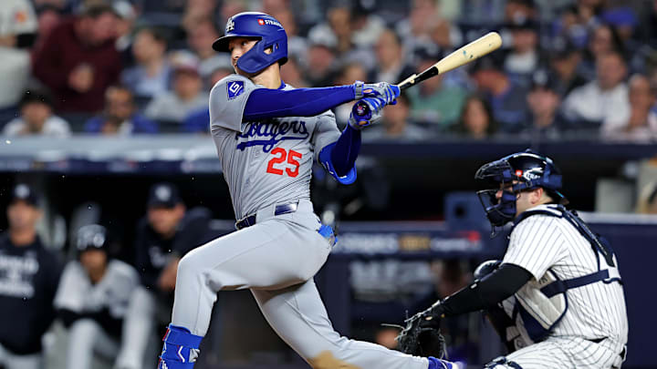 Oct 30, 2024; New York, New York, USA; Los Angeles Dodgers outfielder Tommy Edman (25) breaks his bat while hitting a single during the eighth inning against the New York Yankees in game four of the 2024 MLB World Series at Yankee Stadium. Mandatory Credit: Brad Penner-Imagn Images