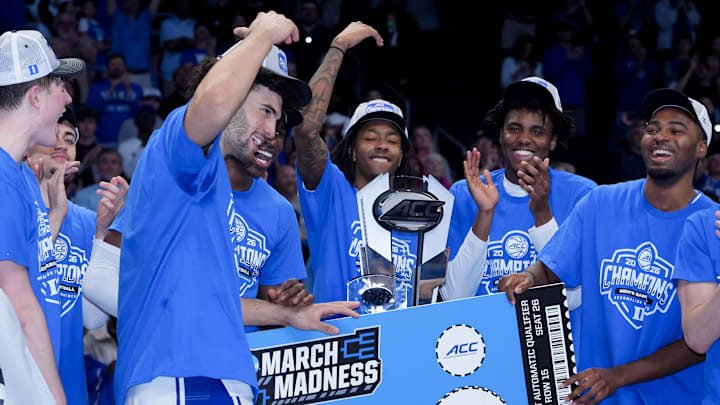 Mar 14, 2026; Charlotte, NC, USA; The Duke Blue Devils celebrate after defeating the Virginia Cavaliers in the men's ACC Conference Tournament Championship at Spectrum Center. Mandatory Credit: Jim Dedmon-Imagn Images