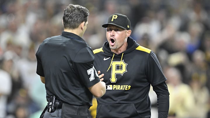 May 30, 2025; San Diego, California, USA; Pittsburgh Pirates manager Don Kelly (12) yells at umpire Edward Jimenez (75) during the eighth inning against the San Diego Padres at Petco Park. Mandatory Credit: Denis Poroy-Imagn Images