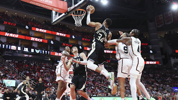 Feb 25, 2025; Houston, Texas, USA; Milwaukee Bucks forward Giannis Antetokounmpo (34) attempts to control the ball during the fourth quarter against the Houston Rockets at Toyota Center. Mandatory Credit: Troy Taormina-Imagn Images