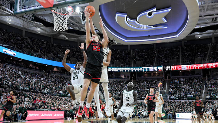 Dec 29, 2025; East Lansing, Michigan, USA; Cornell Big Red guard Jake Fiegen (22) gets his layup blocked by Michigan State Spartans forward Jordan Scott (6) during the first half at Jack Breslin Student Events Center. Mandatory Credit: Dale Young-Imagn Images Dec 29, 2025; East Lansing, Michigan, USA; Cornell Big Red guard Jake Fiegen (22) gets his layup blocked by Michigan State Spartans forward Jordan Scott (6) during the first half at Jack Breslin Student Events Center. Mandatory Credit: Dale Young-Imagn Images