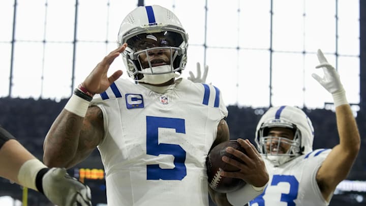 Dec 22, 2024; Indianapolis, Indiana, USA; Indianapolis Colts quarterback Anthony Richardson (5) celebrates after rushing for a touchdown during a game against the Tennessee Titans at Lucas Oil Stadium. Mandatory Credit: Christine Tannous/USA Today Network via Imagn Images 