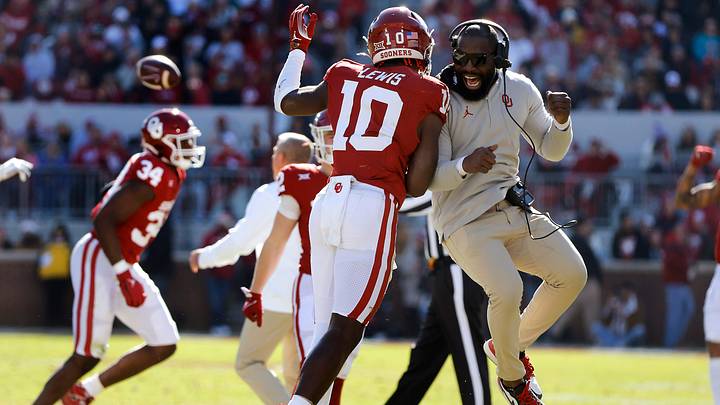 University of Oklahoma Sooners linebacker Kip Lewis (10) celebrates with Sooners co-defensive coordinator/cornerbacks coach Jay Valai during a collegiate football game between the Oklahoma and the TCU Horned Frogs at Gaylord Family-Oklahoma Memorial Stadium in Norman, Oklahoma, on Friday, November 24, 2023. Oklahoma won the game in a blowout, 69-45.