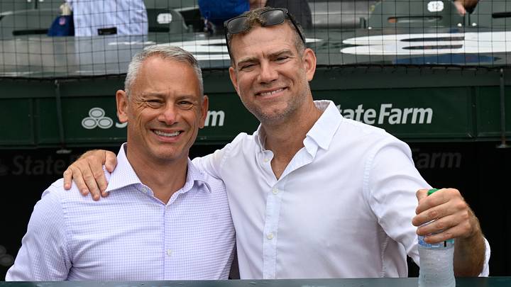 Jul 18, 2026; Chicago, Illinois, USA;  Jed Hoyer, left,  and Theo Epstein, both President of Baseball Operations for the Chicago Cubs talk in the dugout before the team’s game against the Minnesota Twins at Wrigley Field. Mandatory Credit: Matt Marton-Imagn Images