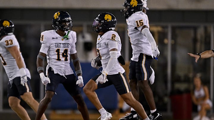 Aug 30, 2025; Dallas, Texas, USA; East Texas A&M Lions defensive back X'Avion Brice (14) and defensive back Lavon Williams (2) and defensive back Cinque Williams (15) celebrate during the game between the Southern Methodist Mustangs and the East Texas A&M Lions at Gerald J. Ford Stadium. Mandatory Credit: Jerome Miron-Imagn Images