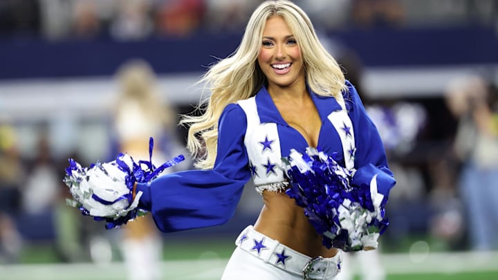 A Dallas Cowboys cheerleader performs in the second half against the Arizona Cardinals at AT&T Stadium.