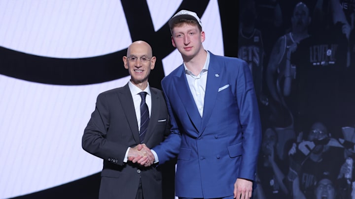 Jun 25, 2025; Brooklyn, NY, USA;  Danny Wolf stands with NBA commissioner Adam Silver after being selected as the 27th pick by the Brooklyn Nets in the first round of the 2025 NBA Draft at Barclays Center. Mandatory Credit: Brad Penner-Imagn Images