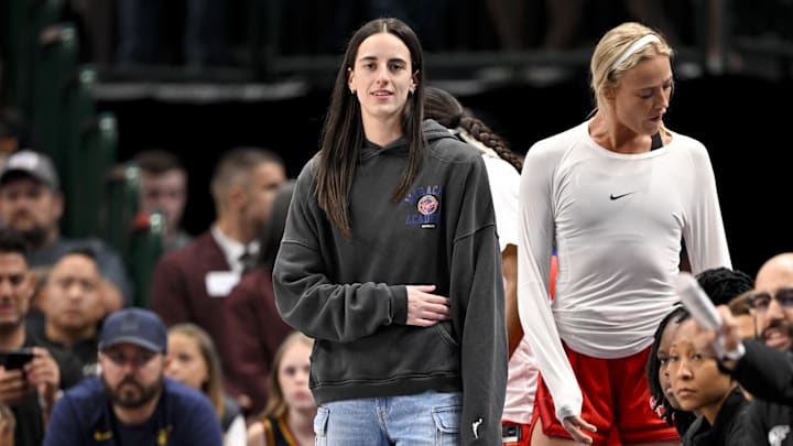 Jun 27, 2025; Dallas, Texas, USA; Indiana Fever guard Caitlin Clark (22) looks on from the team bench during the game against the Dallas Wings at the American Airlines Center. Mandatory Credit: Jerome Miron-Imagn Images