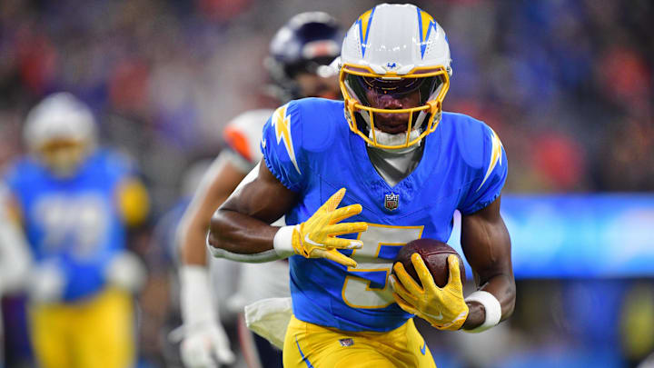 Dec 19, 2024; Inglewood, California, USA; Los Angeles Chargers wide receiver Joshua Palmer (5) runs the ball against the Denver Broncos during the first half at SoFi Stadium. Mandatory Credit: Gary A. Vasquez-Imagn Images