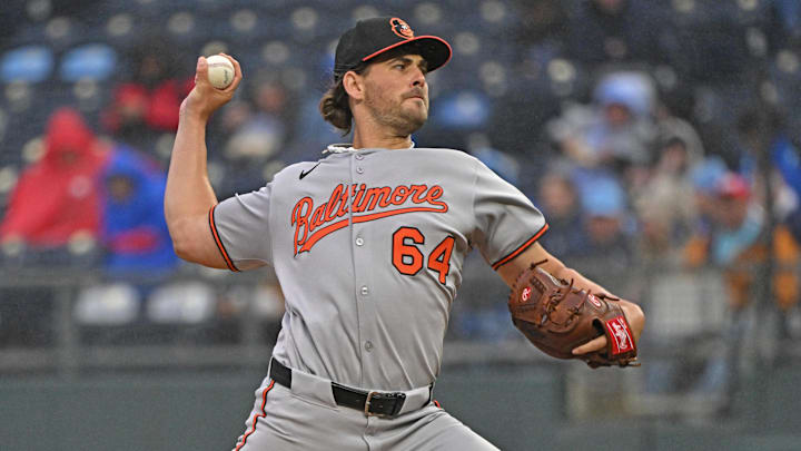 Apr 4, 2025; Kansas City, Missouri, USA;  Baltimore Orioles starting pitcher Dean Kremer (64) throws a pitch in the first inning against the Kansas City Royals at Kauffman Stadium.