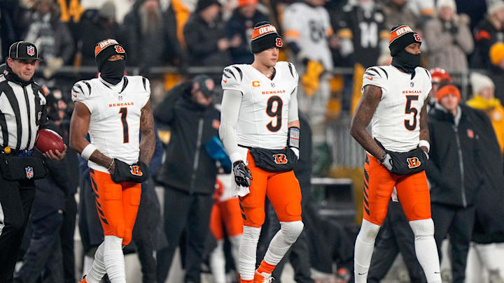 Cincinnati Bengals wide receiver Ja'Marr Chase (1), quarterback Joe Burrow (9) and wide receiver Tee Higgins (5) take the field as captains for the coin toss before the first quarter of the NFL Week 18 game between the Pittsburgh Steelers and the Cincinnati Bengals at Acrisure Stadium in Pittsburgh on Saturday, Jan. 4, 2025. Cincinnati Bengals wide receiver Ja'Marr Chase (1), quarterback Joe Burrow (9) and wide receiver Tee Higgins (5) take the field as captains for the coin toss before the first quarter of the NFL Week 18 game between the Pittsburgh Steelers and the Cincinnati Bengals at Acrisure Stadium in Pittsburgh on Saturday, Jan. 4, 2025.