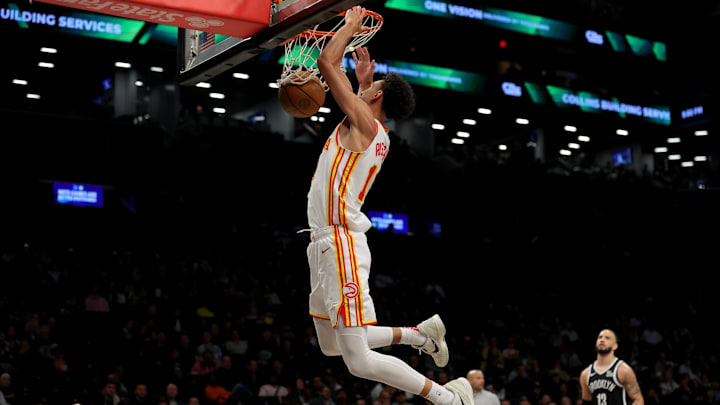 Apr 10, 2025; Brooklyn, New York, USA; Atlanta Hawks forward Zaccharie Risacher (10) dunks against the Brooklyn Nets during the third quarter at Barclays Center.