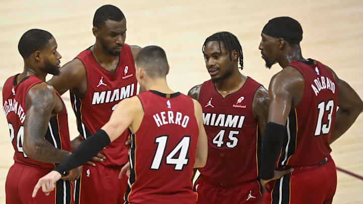 Apr 20, 2025; Cleveland, Ohio, USA; The Miami Heat gather in front of the bench during a timeout in the fourth quarter against the Cleveland Cavaliers at Rocket Arena. Mandatory Credit: David Richard-Imagn Images