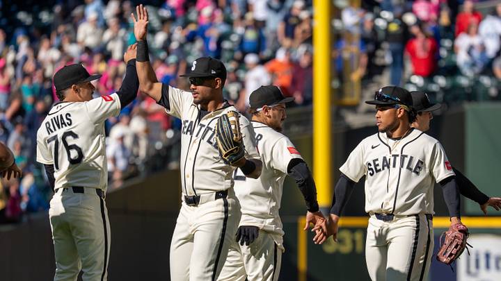 Sep 27, 2026; Seattle, Washington, USA; Seattle Mariners, from left, shortstop Leo Rivas (76), centerfielder Julio Rodriguez (44), first baseman Josh Naylor (12) and left fielder Michael Arroyo (96) celebrate after a game against the Los Angeles Angels at T-Mobile Park. Mandatory Credit: Stephen Brashear-Imagn Images Sep 27, 2026; Seattle, Washington, USA; Seattle Mariners, from left, shortstop Leo Rivas (76), centerfielder Julio Rodriguez (44), first baseman Josh Naylor (12) and left fielder Michael Arroyo (96) celebrate after a game against the Los Angeles Angels at T-Mobile Park. Mandatory Credit: Stephen Brashear-Imagn Images