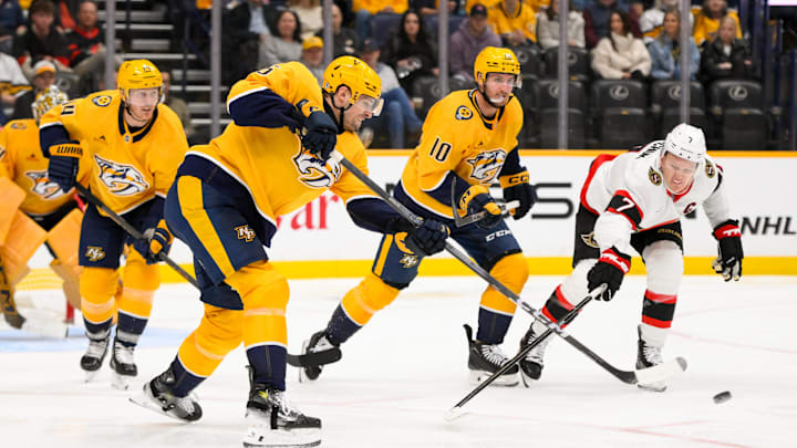 Feb 3, 2025; Nashville, Tennessee, USA;  Nashville Predators defenseman Roman Josi (59) clears the puck against the Ottawa Senators during the third period at Bridgestone Arena. Mandatory Credit: Steve Roberts-Imagn Images