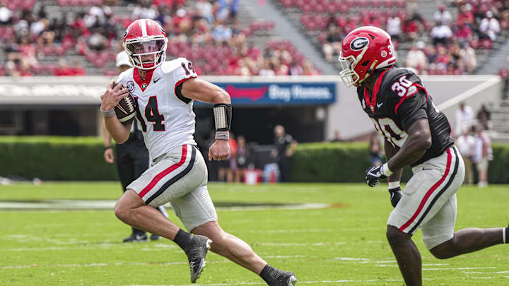 Apr 18, 2026; Athens, GA, USA; Georgia Bulldogs quarterback Gunner Stockton (14) runs against linebacker Terrell Foster (30) during the Georgia Spring football game at Sanford Stadium. Mandatory Credit: Dale Zanine-Imagn Images