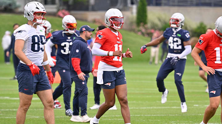 Jun 9, 2025; Foxborough, MA, USA; New England Patriots quarterback Joshua Dobbs (11) warms up at minicamp at Gillette Stadium. Mandatory Credit: Eric Canha-Imagn Images