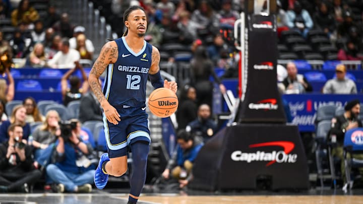 Dec 28, 2025; Washington, District of Columbia, USA; Memphis Grizzlies guard Ja Morant (12) advances the ball against the Washington Wizards during the first half at Capital One Arena. Mandatory Credit: Brad Mills-Imagn Images