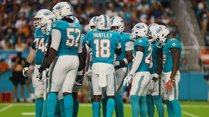 Miami Dolphins quarterback Tyler Huntley (18) talks to his teammates before a play against the Tennessee Titans during the first quarter at Hard Rock Stadium.
