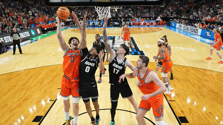 Mar 21, 2026; Greenville, SC, USA; Illinois Fighting Illini forward David Mirkovic (0) goes for the basket as VCU Rams guard Brandon Jennings (0) defends during the second half during a second round game of the men's 2026 NCAA Tournament at Bon Secours Wellness Arena. Mandatory Credit: Bob Donnan-Imagn Images