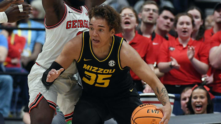 Mar 13, 2024; Nashville, TN, USA; Missouri Tigers forward Noah Carter (35) works against Georgia Bulldogs guard Noah Thomasson (3) during the first half at Bridgestone Arena. Mandatory Credit: Christopher Hanewinckel-Imagn Images