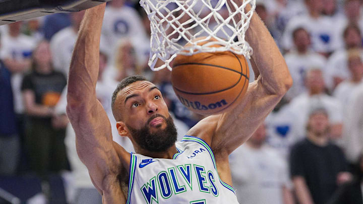 May 16, 2024; Minneapolis, Minnesota, USA; Minnesota Timberwolves center Rudy Gobert (27) dunks against the Denver Nuggets in the third quarter during game six of the second round for the 2024 NBA playoffs at Target Center. Mandatory Credit: Brad Rempel-Imagn Images