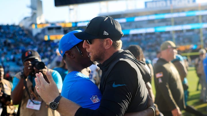 Jacksonville Jaguars head coach Liam Coen hugs familar faces after the game of an NFL football game at EverBank Stadium, Sunday, Nov. 16, 2025 in Jacksonville, Fla. The Jacksonville Jaguars defeated the Los Angeles Chargers 35-6. [Corey Perrine/Florida Times-Union]