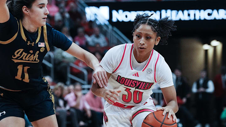 Louisville's Jayda Curry (30) drives against Notre Dame's 	Sonia Citron (11) during their game at the KFC Yum! Center in Louisville, Ky. on Feb. 2, 2025.