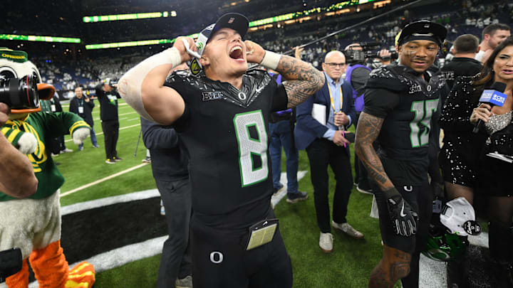 Dec 7, 2024; Indianapolis, IN, USA; Oregon Ducks quarterback Dillon Gabriel (8) celebrates defeating the Penn State Nittany Lions to win the Big Ten Championship in the 2024 Big Ten Championship game at Lucas Oil Stadium. Mandatory Credit: Robert Goddin-Imagn Images