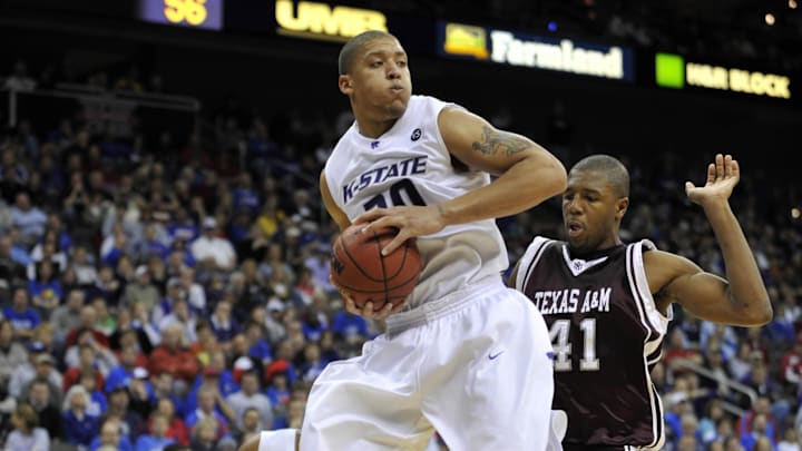 March 14, 2008; Kansas City, MO, USA; Kansas State Wildcats forward Michael Beasley (30) pulls down a rebound in front of Texas A&M Aggies forward Chinemulu Elonu (41) in the second half during the 2008 Big Twelve Mens Basketball Tournament at the Sprint Center. Texas A&M defeated Kansas State 63-60. Mandatory Credit: Peter G. Aiken-Imagn Images